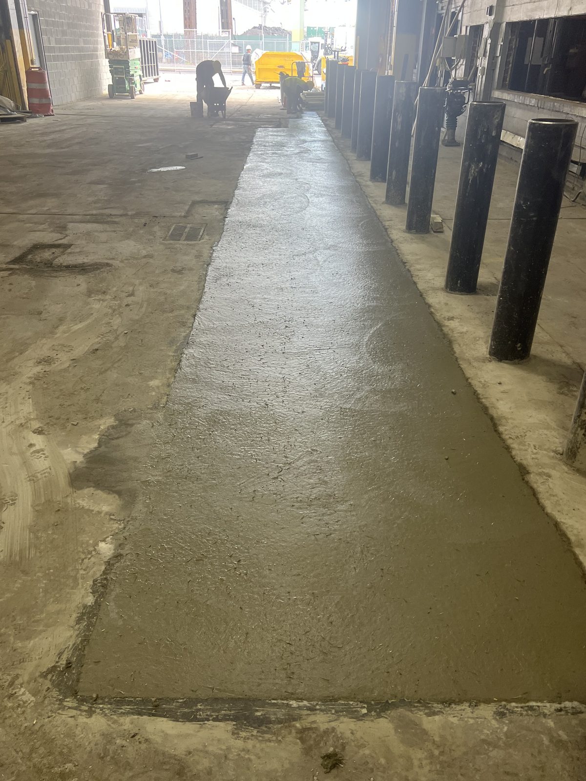 JBS commercial concrete slab repair at NYC facility with safety bollards