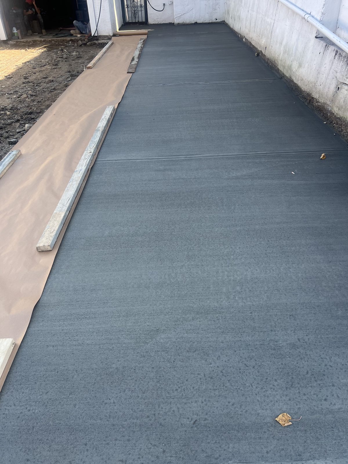 JBS new concrete driveway pour with broom finish, NYC residential