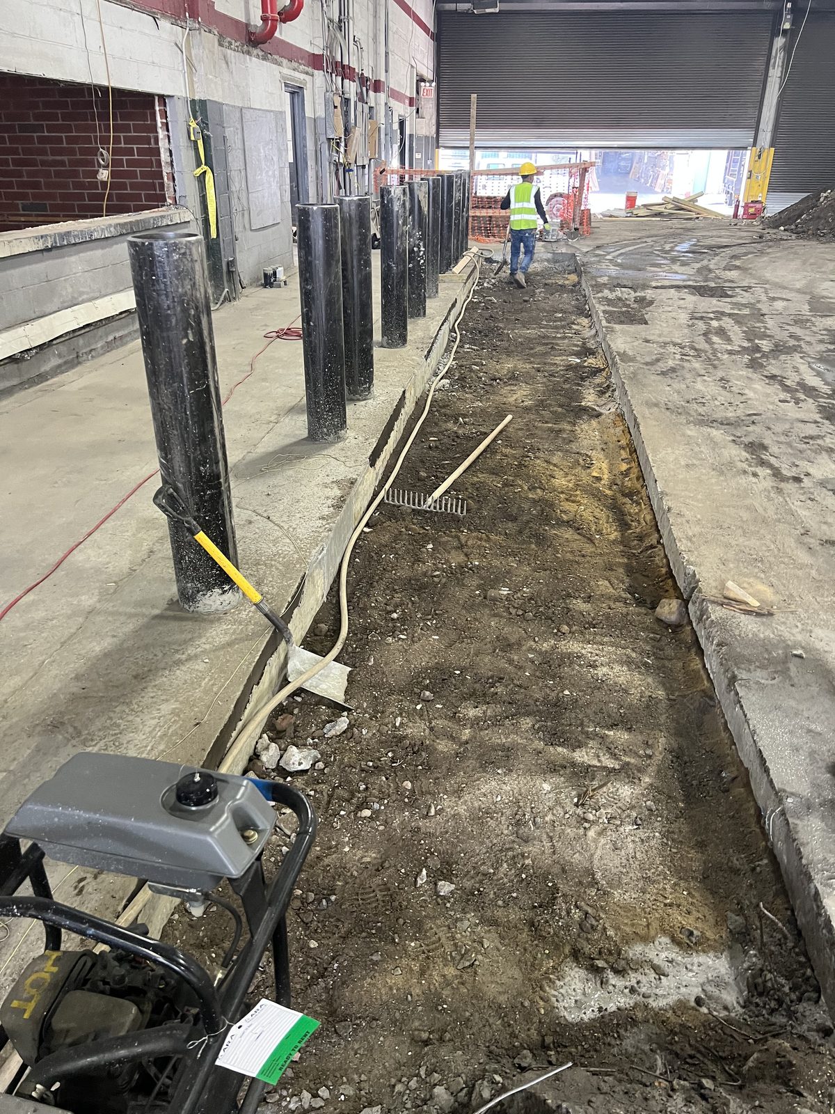 JBS excavated subgrade trench for commercial concrete with plate compactor