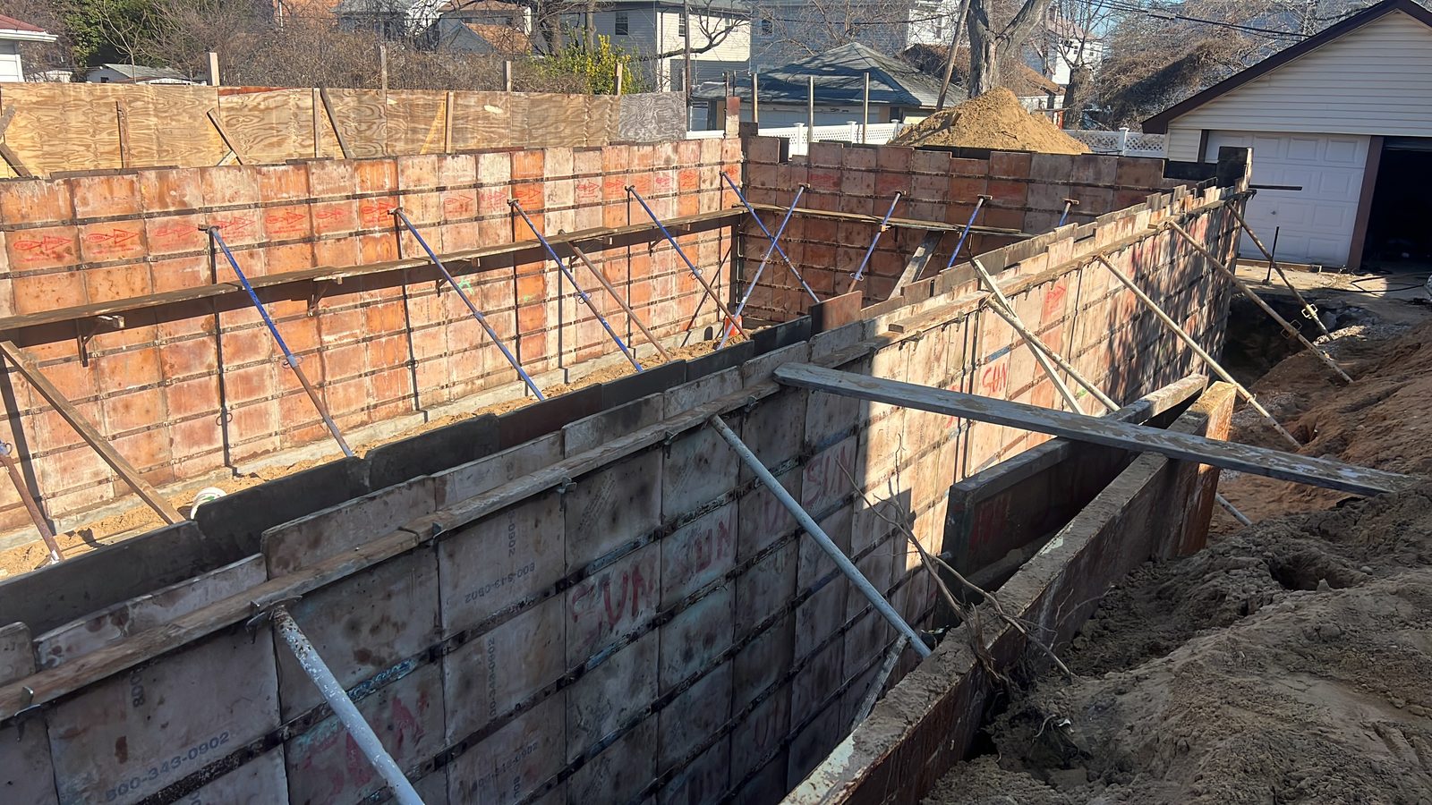 JBS Symons concrete forms erected and braced for foundation pour, residential new construction