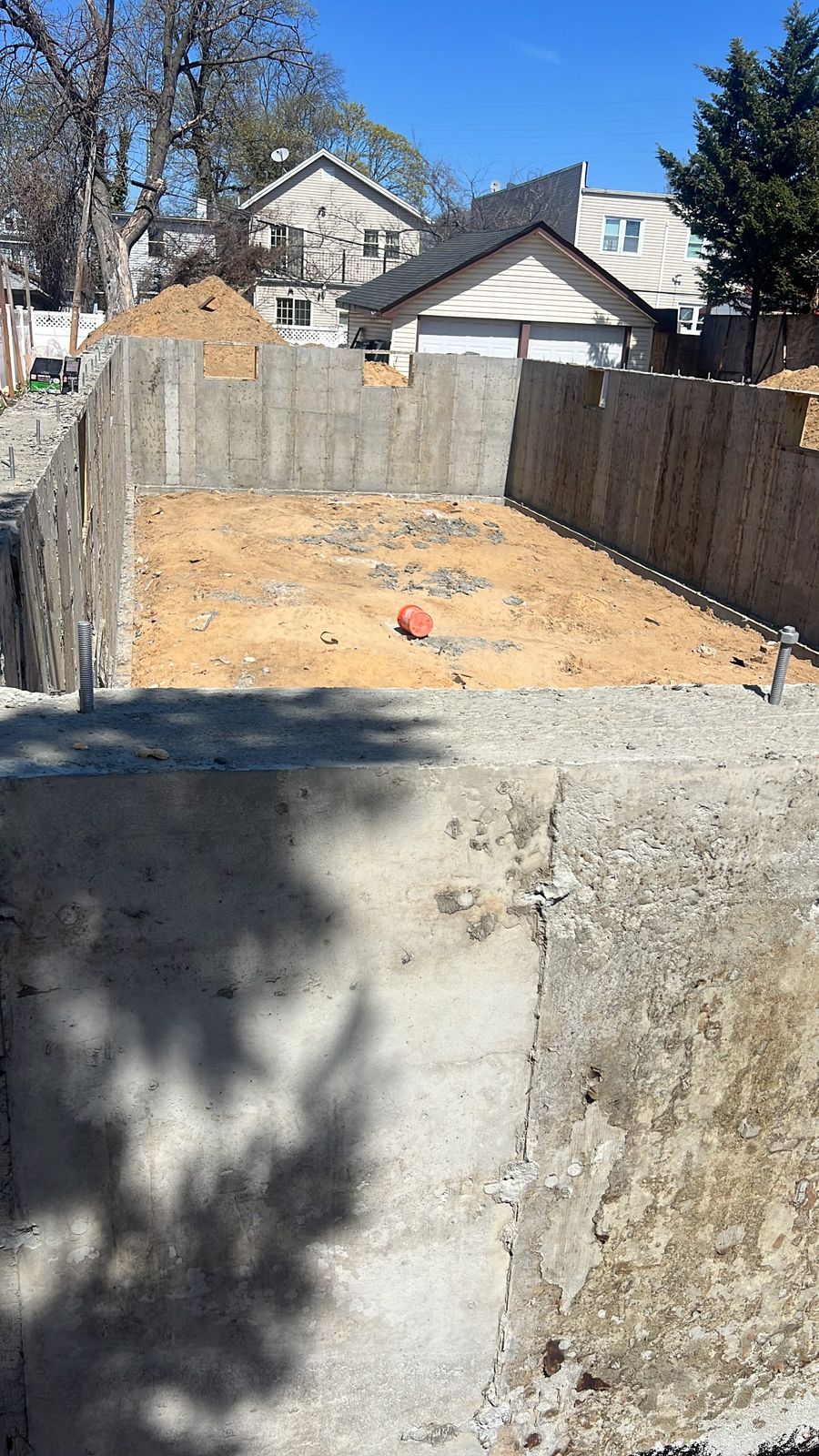 JBS poured concrete foundation walls with anchor bolts set, NYC residential new build
